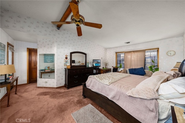 carpeted bedroom with ceiling fan and lofted ceiling with beams