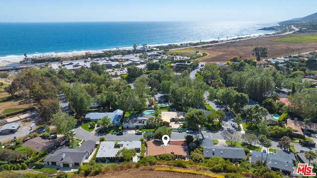 aerial view with a water view and a view of the beach