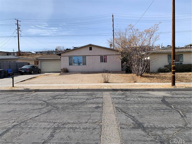 single story home with a garage