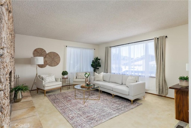 living room featuring a textured ceiling