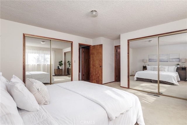 carpeted bedroom with a textured ceiling