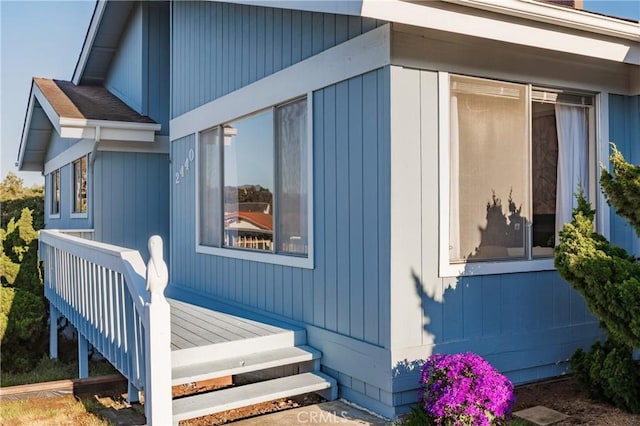 view of home's exterior with a wooden deck