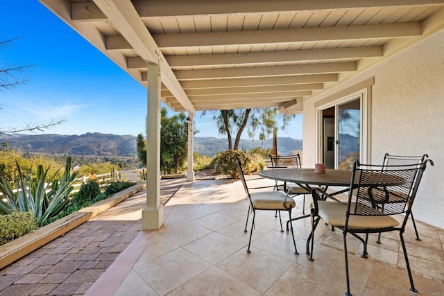 view of patio / terrace with a mountain view