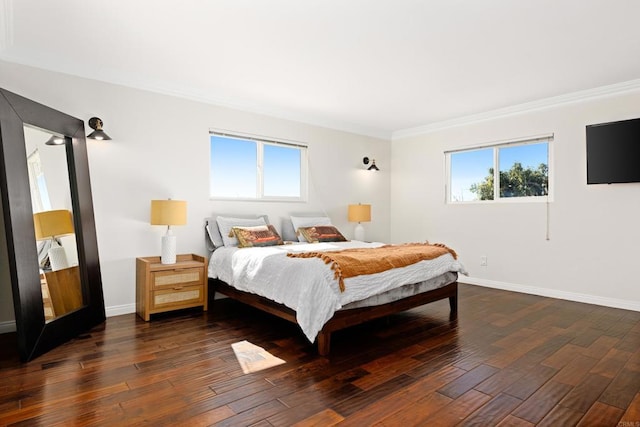 bedroom featuring dark hardwood / wood-style flooring and ornamental molding