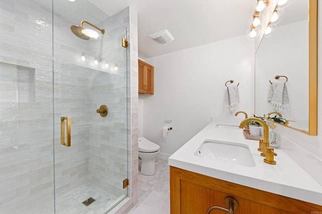 bathroom featuring walk in shower, vanity, and toilet