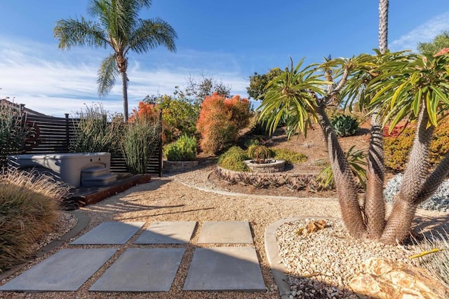 view of yard with a hot tub and a patio