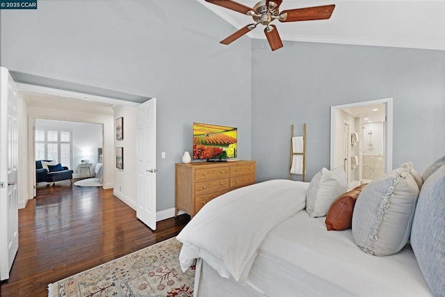 bedroom with ceiling fan, high vaulted ceiling, ensuite bathroom, and dark hardwood / wood-style flooring