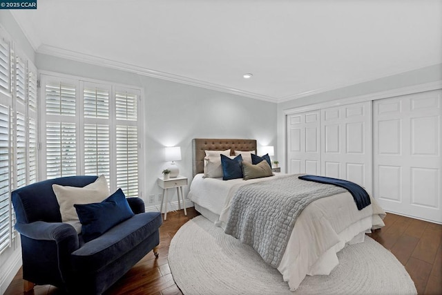 bedroom with crown molding, dark hardwood / wood-style floors, and a closet