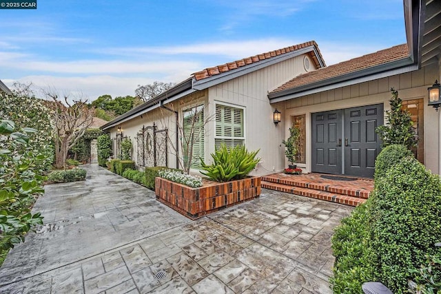 property entrance with a patio area