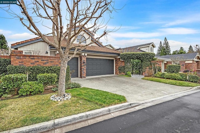 view of front of home featuring a garage and a front lawn