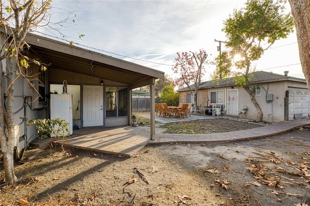 rear view of property featuring a patio