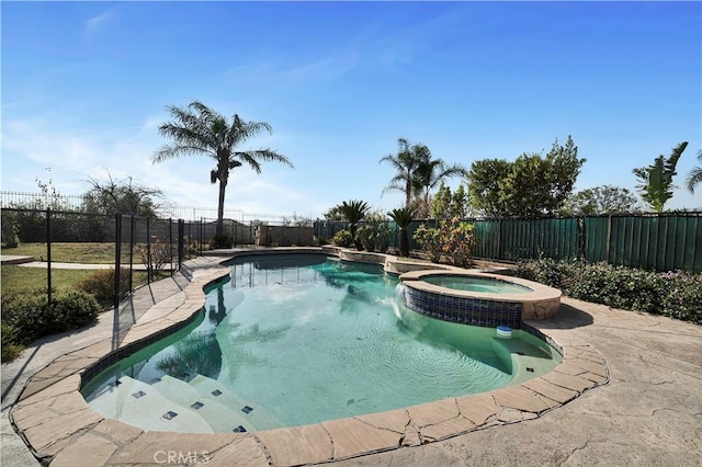 view of swimming pool with an in ground hot tub