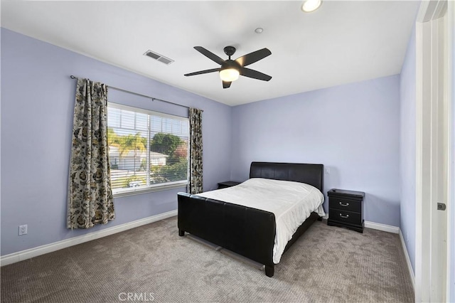 bedroom with light carpet and ceiling fan