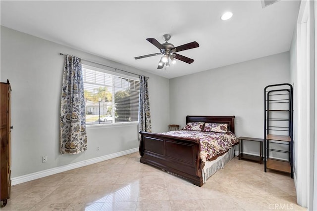 tiled bedroom featuring ceiling fan