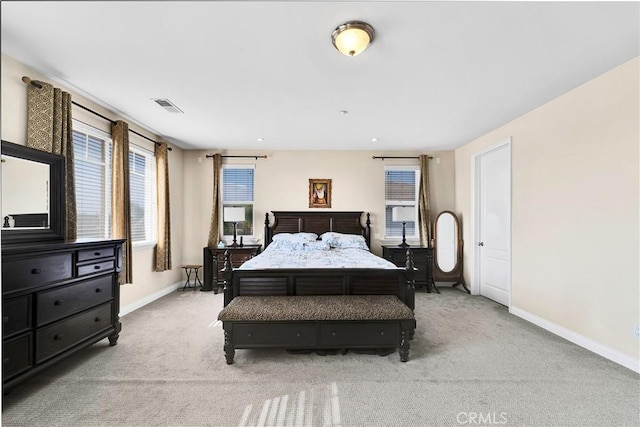 bedroom featuring light colored carpet