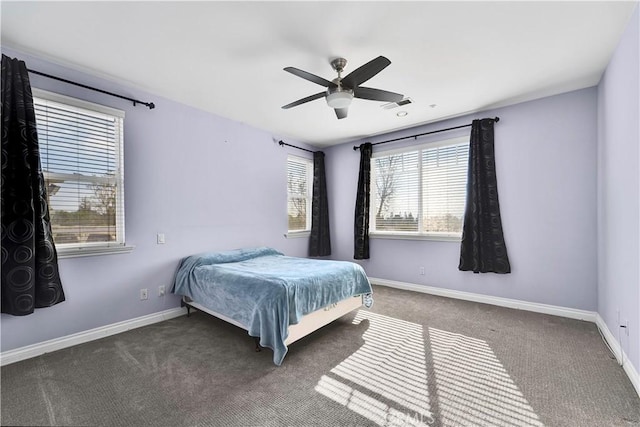 bedroom featuring dark carpet and ceiling fan