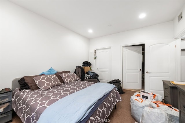 bedroom featuring dark colored carpet