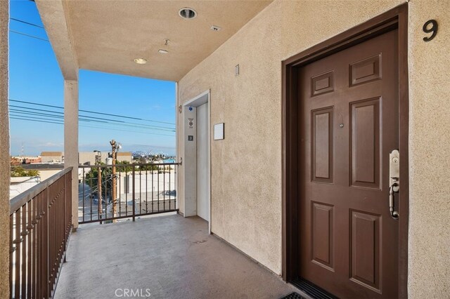 property entrance with a balcony