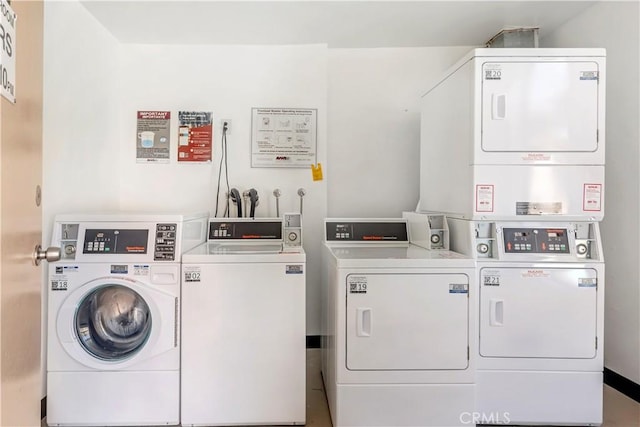 laundry area with separate washer and dryer and stacked washer / drying machine