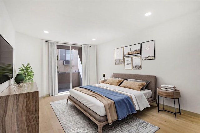 bedroom with access to exterior and light wood-type flooring