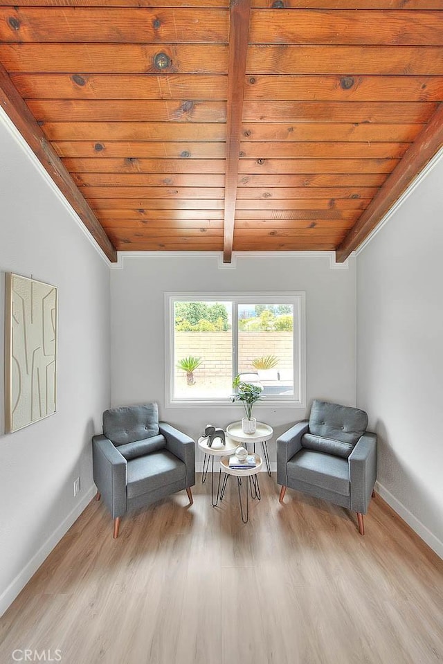 sitting room featuring wood ceiling, lofted ceiling with beams, and light hardwood / wood-style flooring