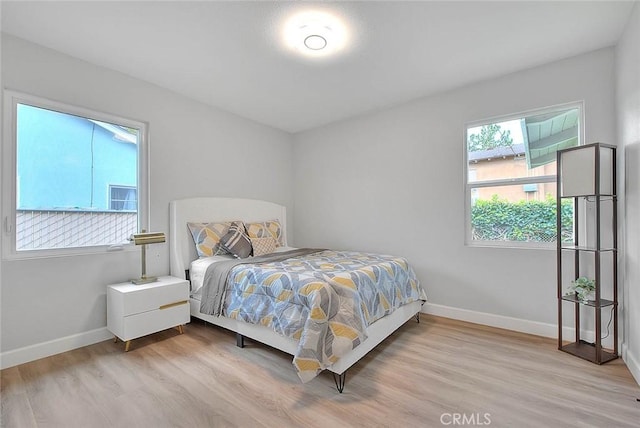 bedroom with light hardwood / wood-style flooring