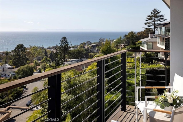 balcony featuring a water view