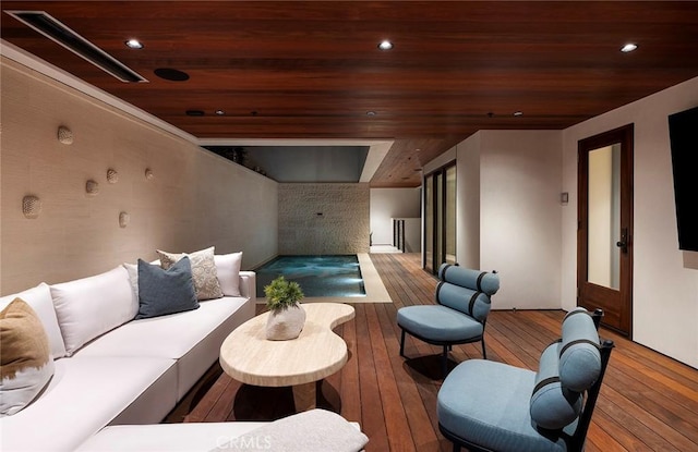 living room with wood ceiling and hardwood / wood-style flooring