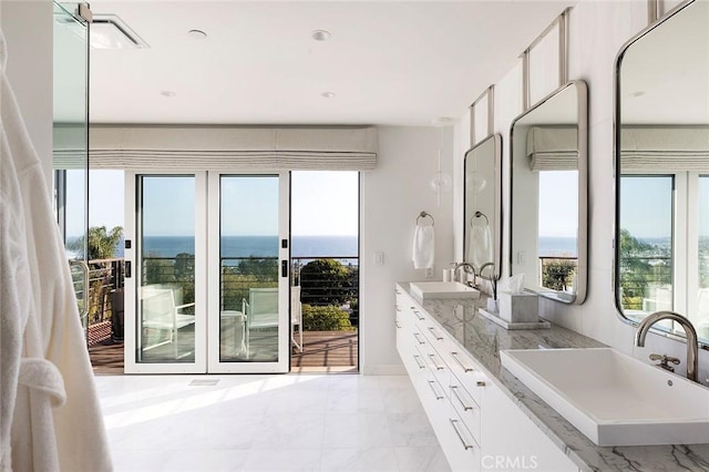 bathroom with vanity and plenty of natural light