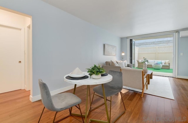 dining area featuring wood-type flooring