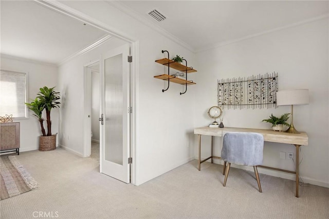 carpeted home office featuring crown molding