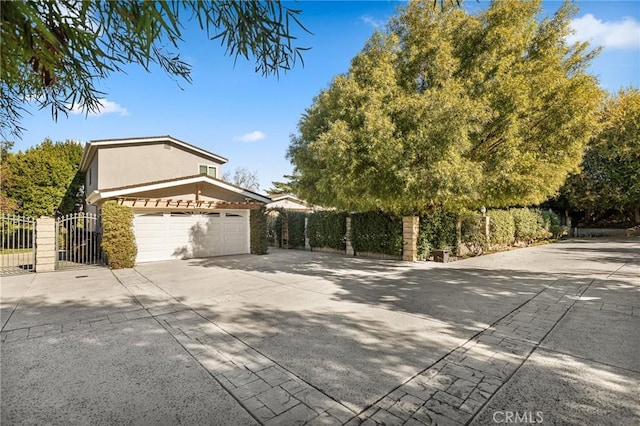 view of side of property with a garage