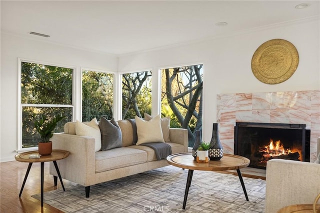 sunroom / solarium featuring a fireplace