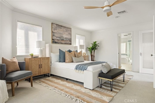 bedroom with crown molding, carpet flooring, and multiple windows