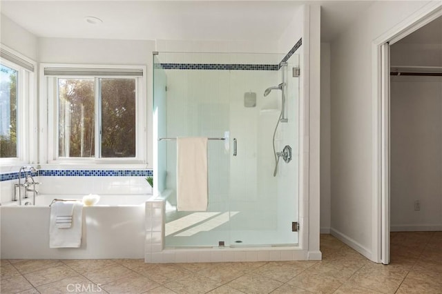 bathroom featuring separate shower and tub