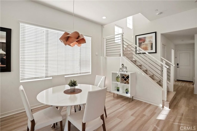 dining area with plenty of natural light and light wood-type flooring