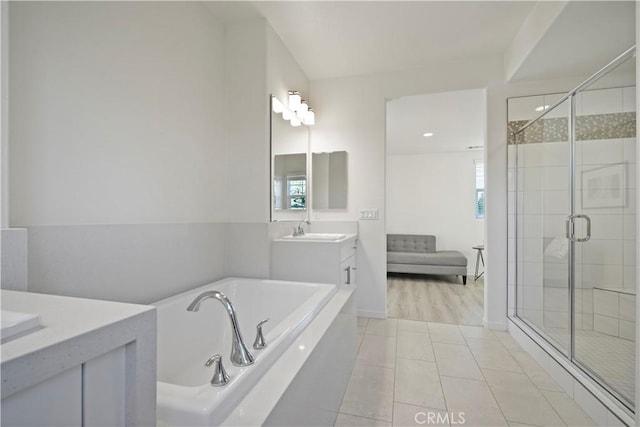 bathroom with vanity, separate shower and tub, and tile patterned floors