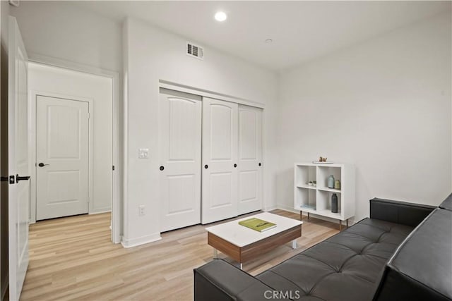 living room with light hardwood / wood-style floors