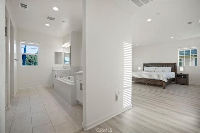 bathroom with vanity and hardwood / wood-style flooring