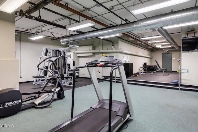 workout area featuring a wall unit AC