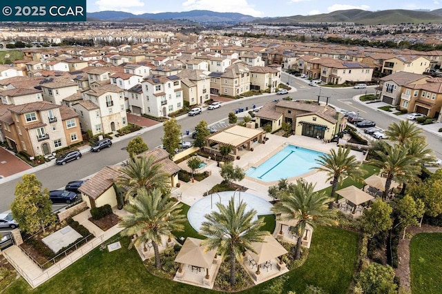 birds eye view of property featuring a mountain view