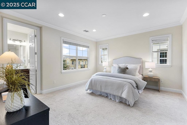 bedroom with crown molding and carpet