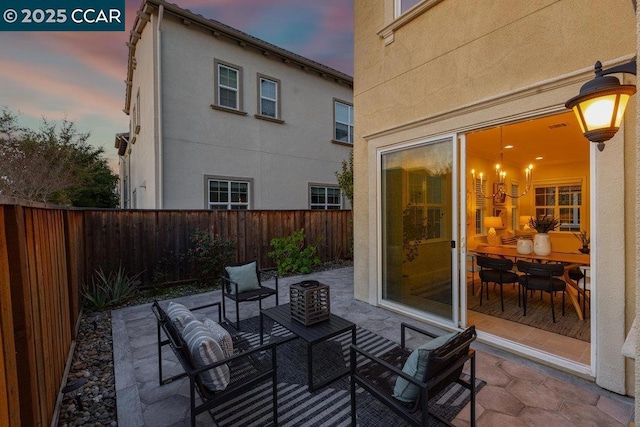 view of patio terrace at dusk