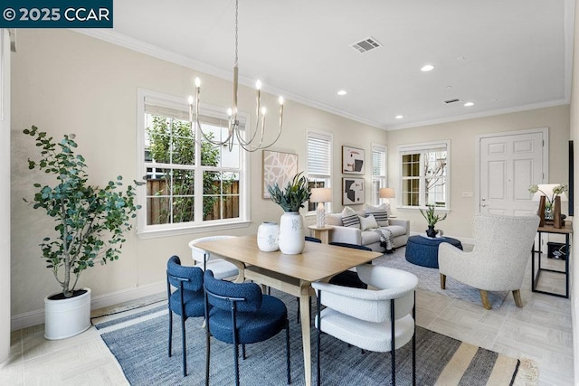 dining area with a notable chandelier and crown molding