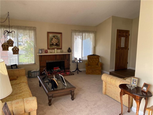 living room with a fireplace, carpet, and a textured ceiling