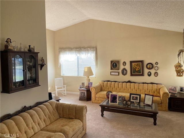 living room featuring lofted ceiling, light colored carpet, and a textured ceiling