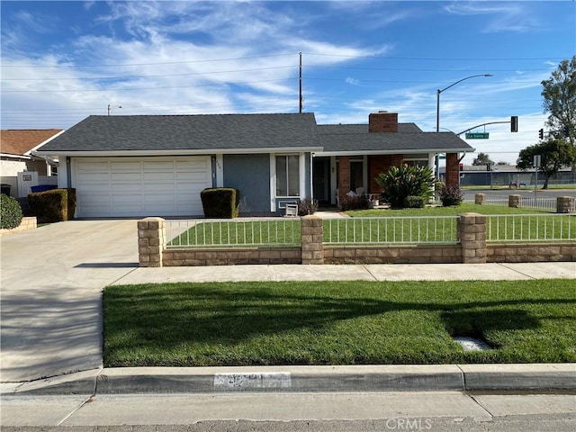 ranch-style house with a garage and a front lawn