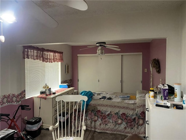 bedroom with ceiling fan and a closet