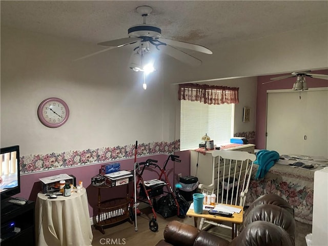 living room with hardwood / wood-style flooring and ceiling fan