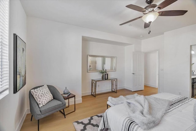 bedroom with ceiling fan and light hardwood / wood-style flooring